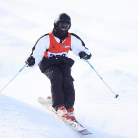 One skier competing in moguls event